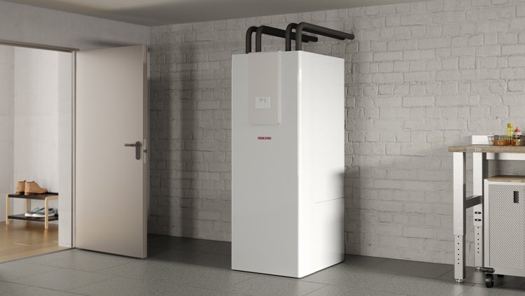 Εξωτερική μονάδα αντλίας θερμότητας STIEBEL ELTRON HPA-O εγκατεστημένη σε μοντέρνο σπίτι, για αποδοτική θέρμανση και ψύξη με τεχνολογία αέρα-νερού.